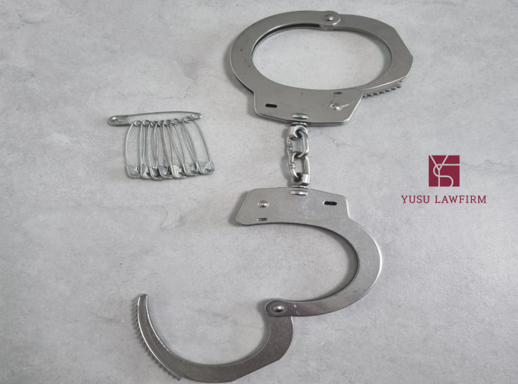 Handcuffs symbolizing criminal charges and theft penalties in Korea
